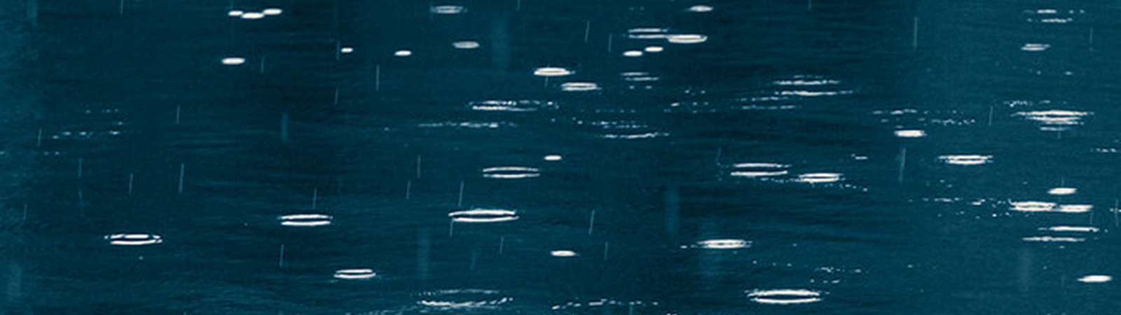 Drops of rain in water